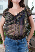 Elektra Vintage women's sheer peasant crop top with mixed Y2K-inspired prints, lightweight and stylish for casual wear.