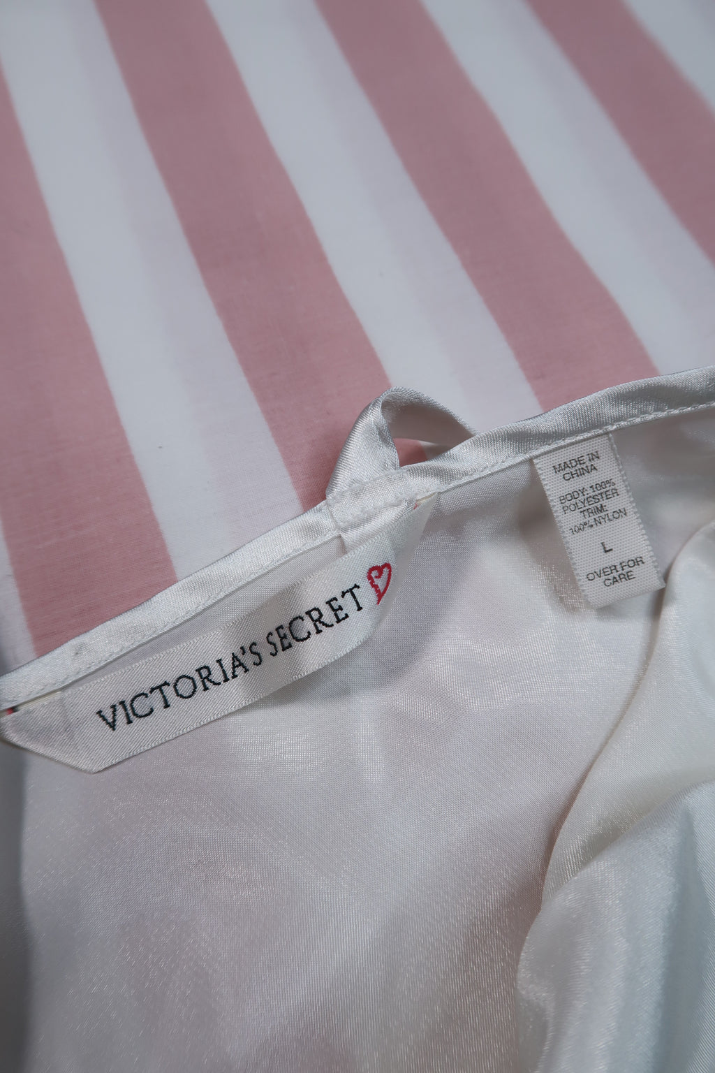 Vintage 90s Victoria’s Secret white satin lace slip dress by Elektra Vintage, featuring delicate lace details and a smooth satin finish.