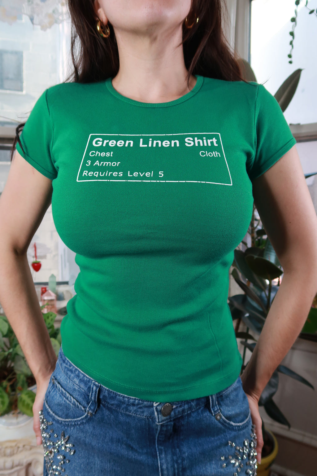 Green vintage Y2K World of Warcraft graphic baby tee for women, by Elektra Vintage, featuring colorful gaming-inspired design.
