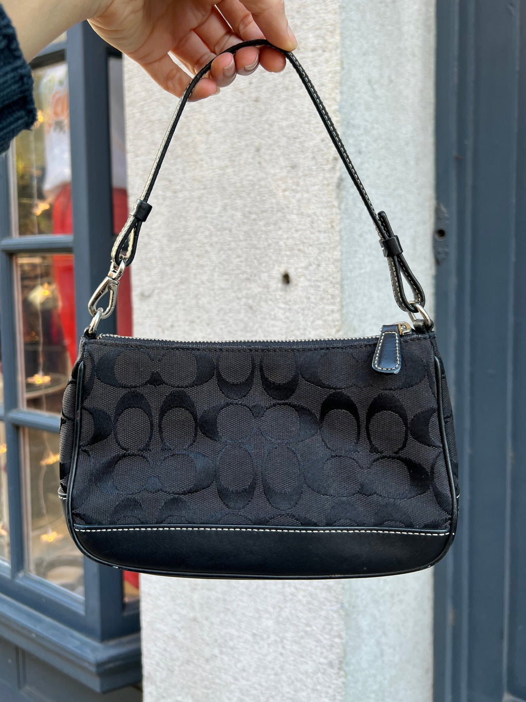 Elektra Vintage black signature C demi shoulder bag with gold-tone hardware, featuring a sleek leather design and top handle.