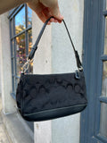 Vintage black Coach Signature C Demi Shoulder Bag by Elektra Vintage with gold-tone hardware and classic design.