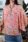 Women's vintage Y2K orange paisley peasant blouse with sequin trim by Elektra Vintage, featuring long sleeves and boho style.