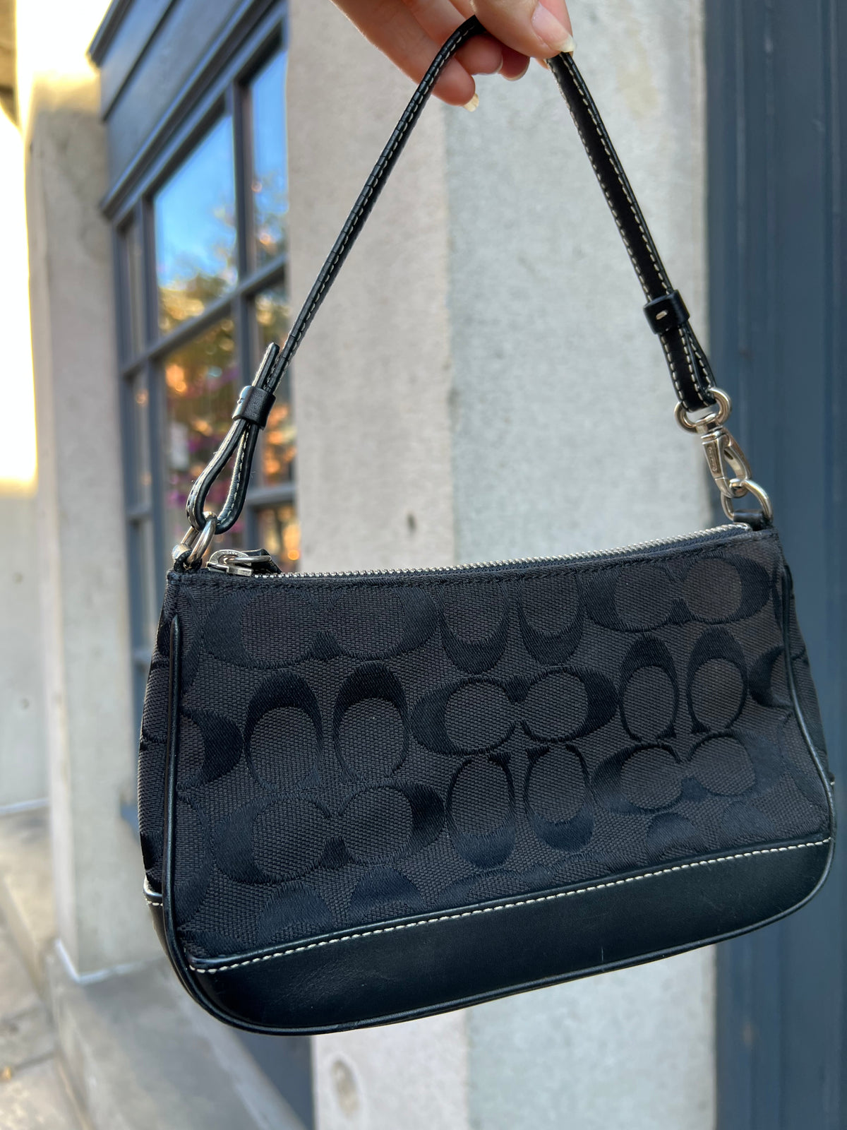Vintage black Coach Signature C Demi Shoulder Bag by Elektra Vintage, featuring a stylish leather design and signature logo details.