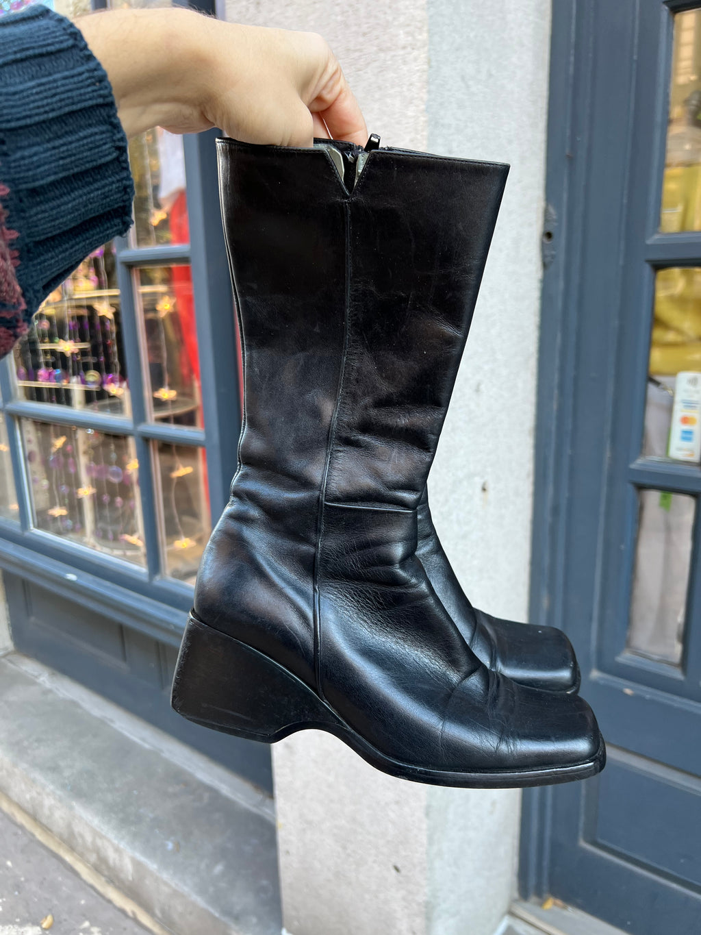 Vintage black leather calf boots by Elektra Vintage, showing classic design and textured leather material.