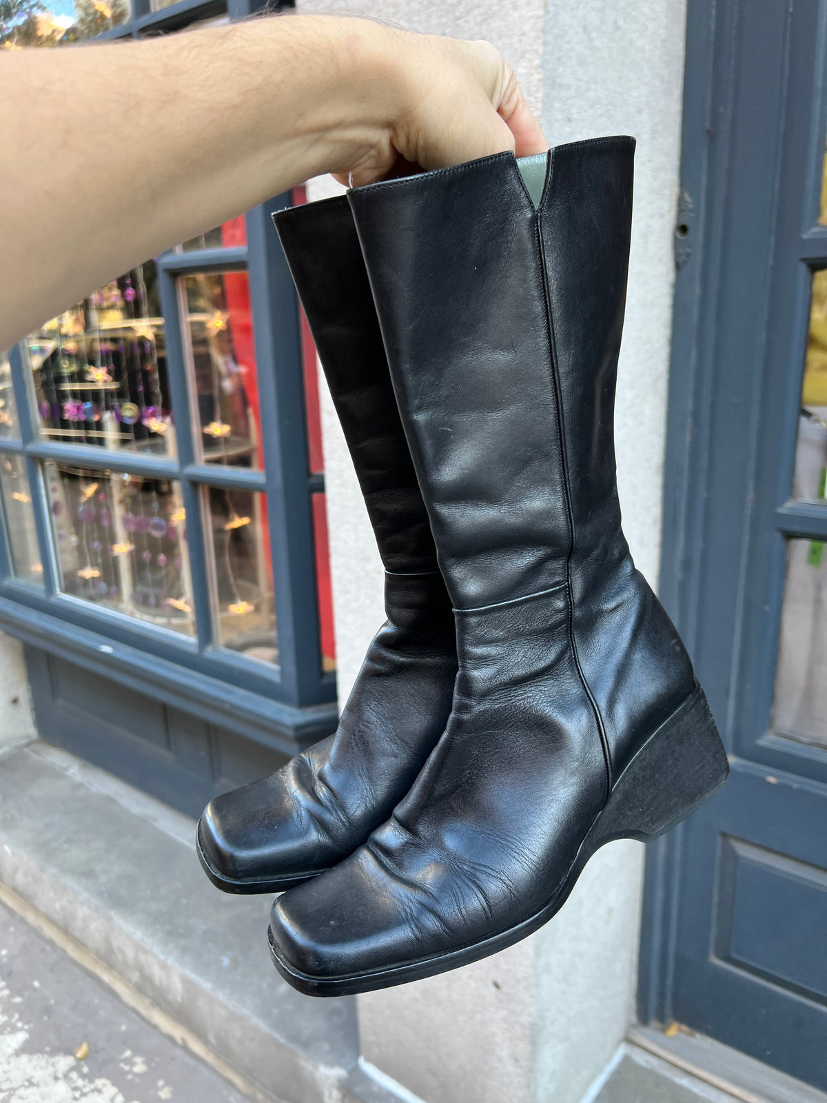 Vintage black leather calf boots by Elektra Vintage, showing classic style and smooth leather texture.