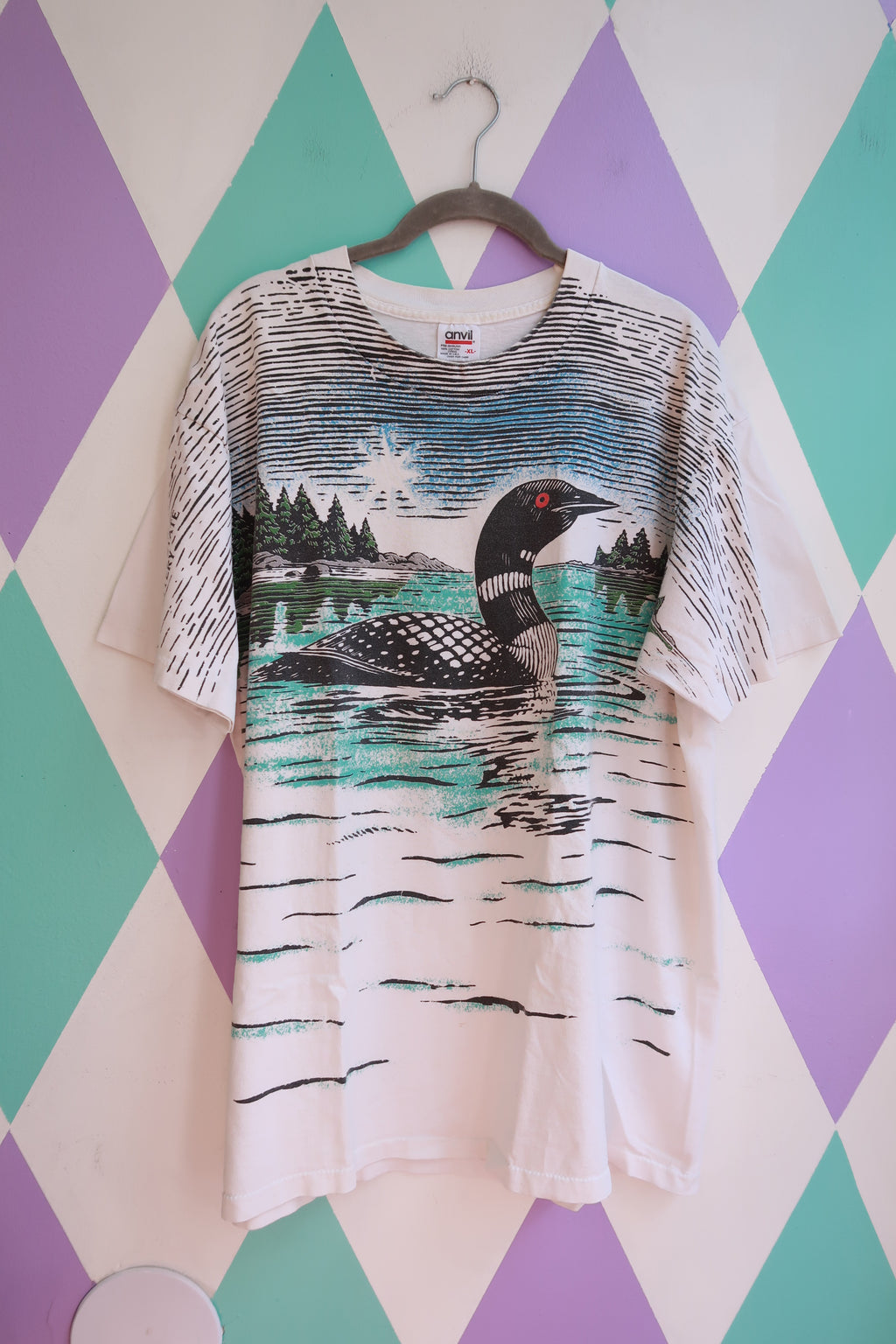 Men's vintage Elektra Wildlife T-shirt with all-over loon and nature graphic, made by Anvil, showcasing a detailed wildlife design.