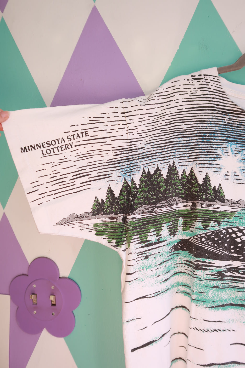 Men's vintage Elektra Vintage wildlife graphic T-shirt featuring loon and nature designs on the all-over print.