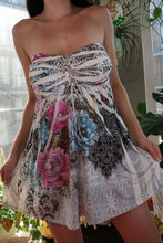 Load image into Gallery viewer, Vintage 2000s Elektra Vintage strapless floral rhinestone mini dress shown on a hanger, highlighting its vibrant print and sparkling details.
