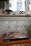 Six vintage etched floral stemmed cocktail glasses by Elektra Vintage, showcasing intricate floral designs on clear glass.