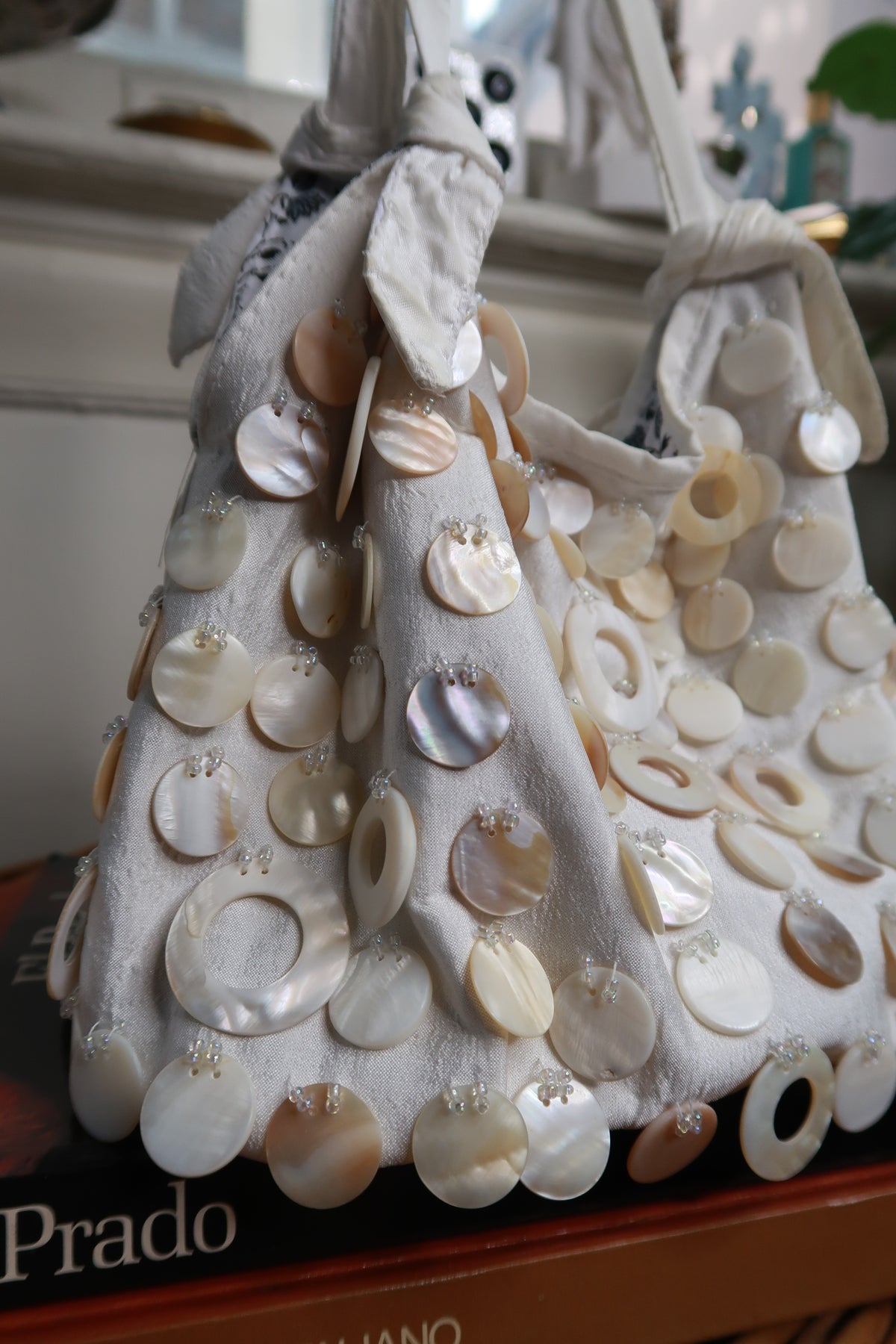 Vintage Y2K cream satin shoulder bag with beaded accents and mother of pearl shell details by Elektra Vintage.