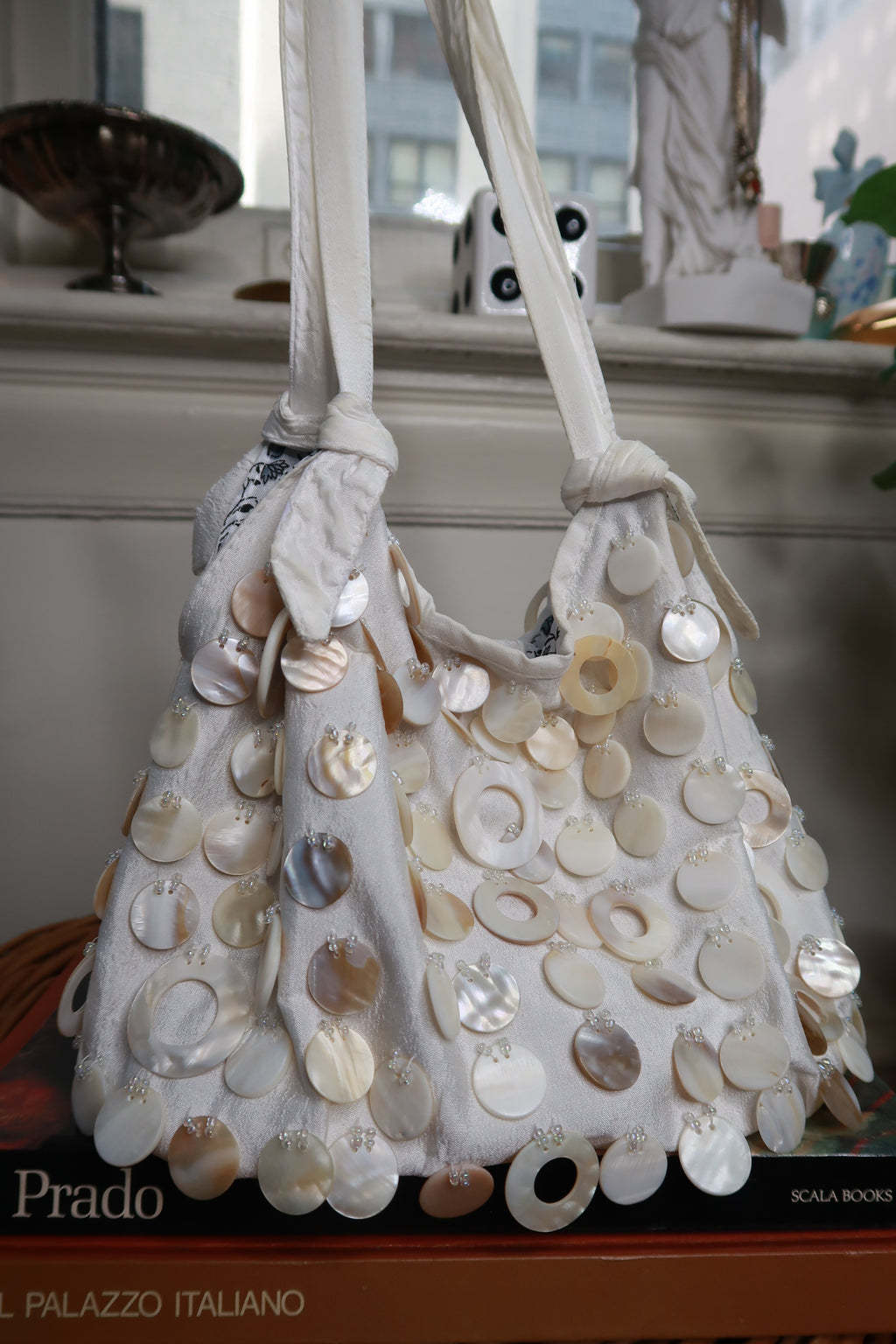 Vintage Y2K cream satin shoulder bag with beaded accents and mother of pearl shell details from Elektra Vintage.