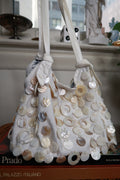 Vintage Y2K cream satin shoulder bag with beaded accents and mother of pearl shell details from Elektra Vintage.