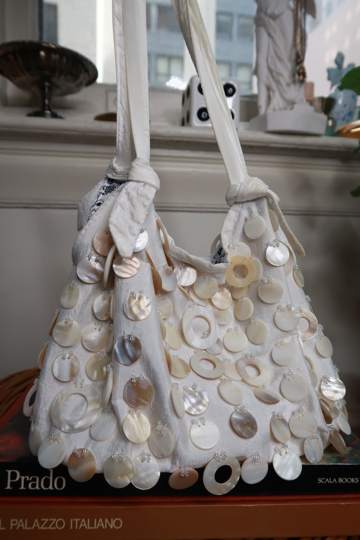 Vintage Y2K cream satin shoulder bag with beaded accents and mother of pearl shell details from Elektra Vintage.