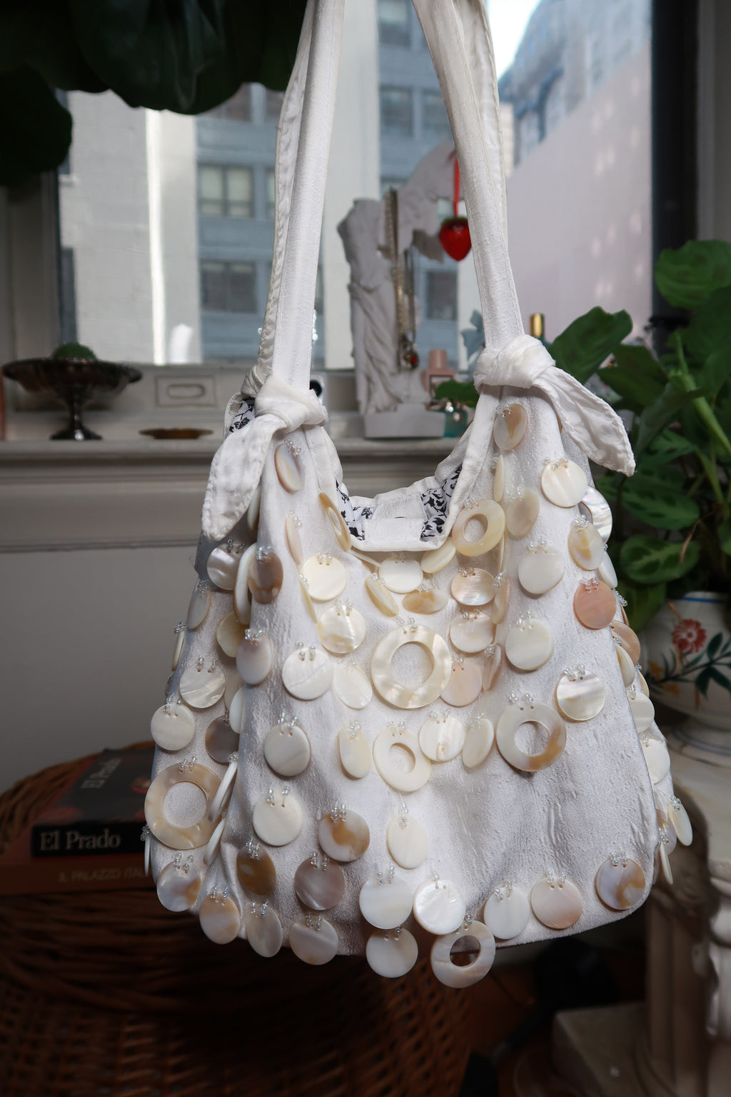 Vintage Y2K cream satin shoulder bag with beaded accents and mother of pearl shell details by Elektra Vintage.