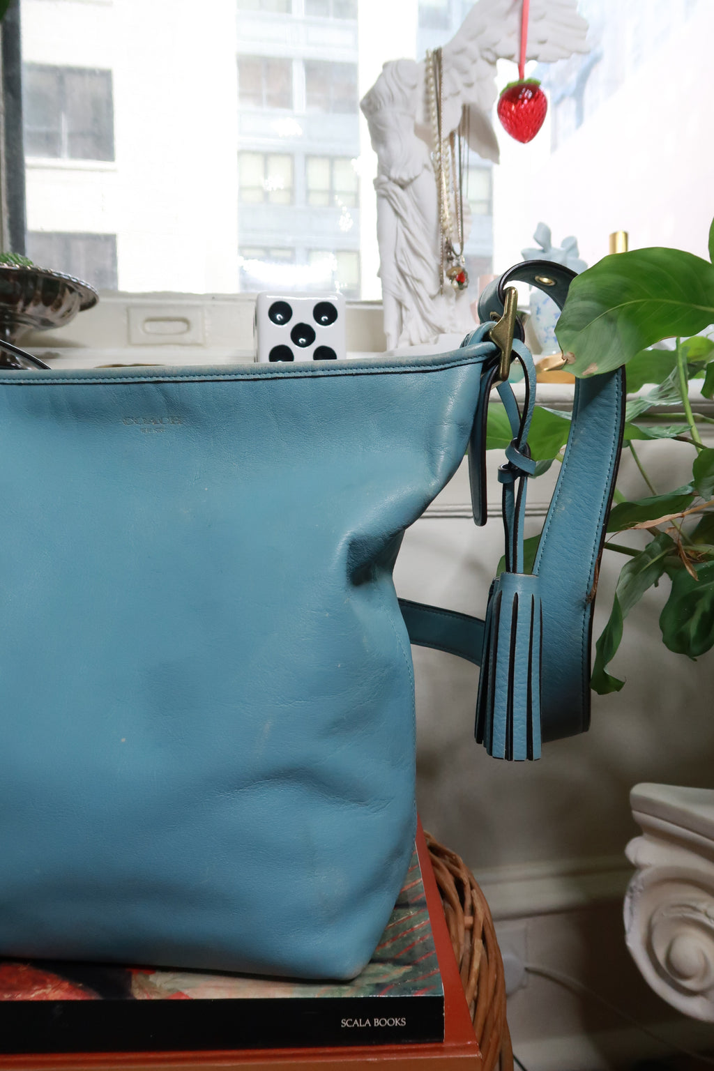 Vintage Coach 19889 blue leather tassel bag with legacy design, featuring leather tassels and classic bag details by Elektra Vintage