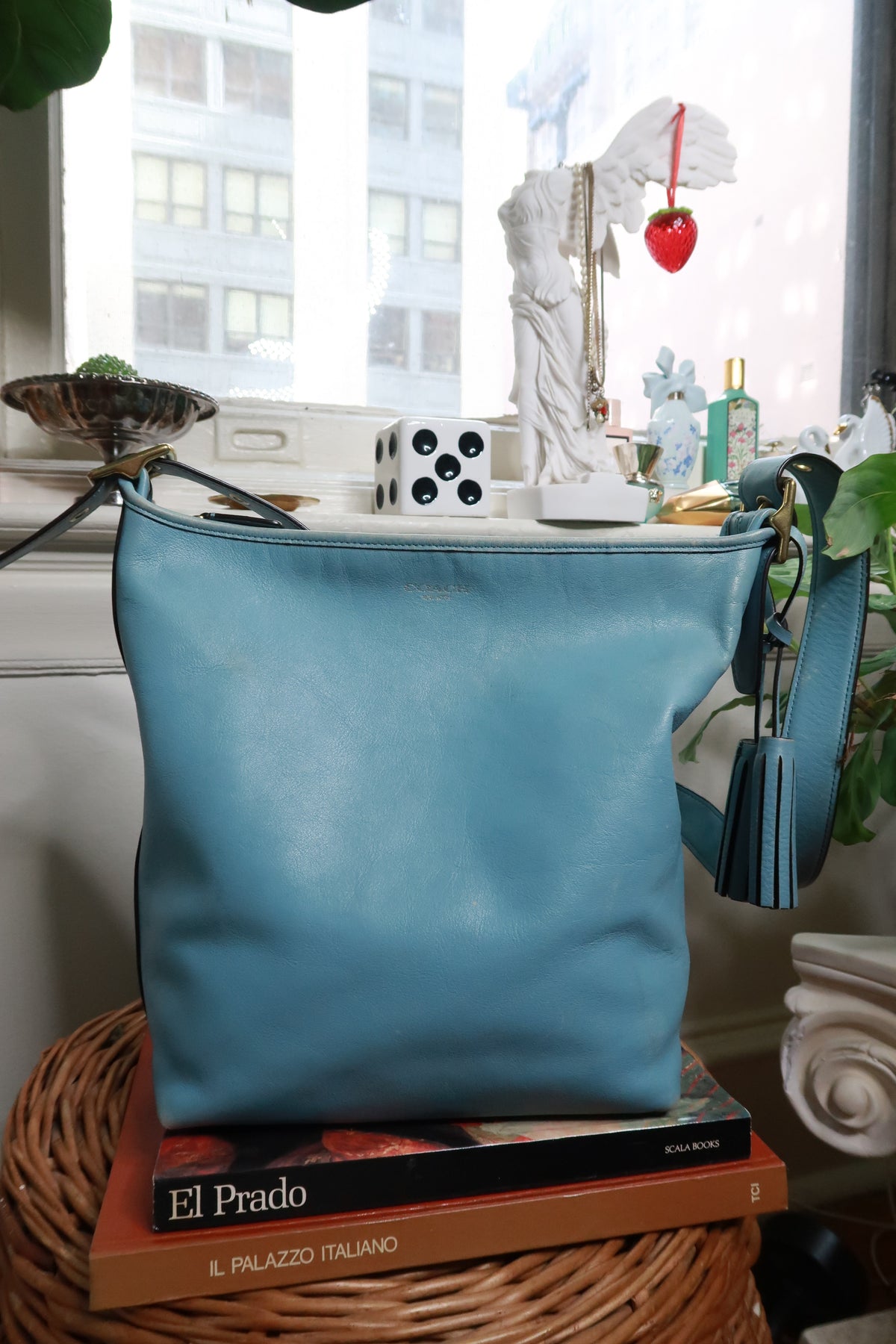 Elektra Vintage blue leather Coach Legacy tassel bag with vintage design, featuring leather tassels and structured bag shape.