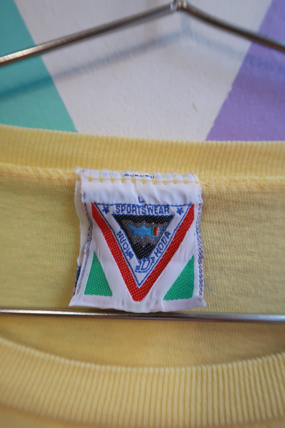 Men's Vintage Austria Crest Graphic T-Shirt by Elektra Vintage, yellow travel souvenir tee with eagle and crest design.