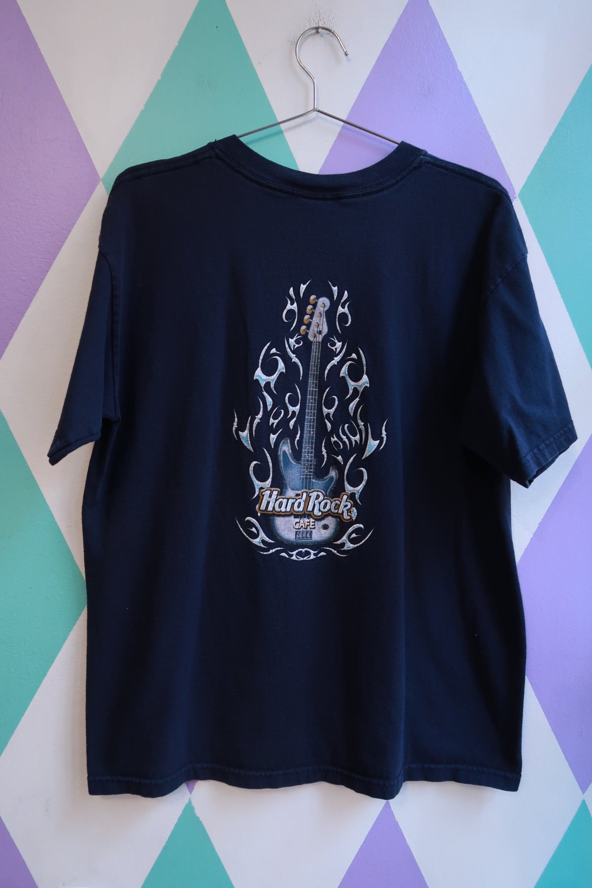 Men's navy graphic T-shirt by Elektra Vintage featuring a vintage Y2K Hard Rock Cafe Florence guitar logo design.