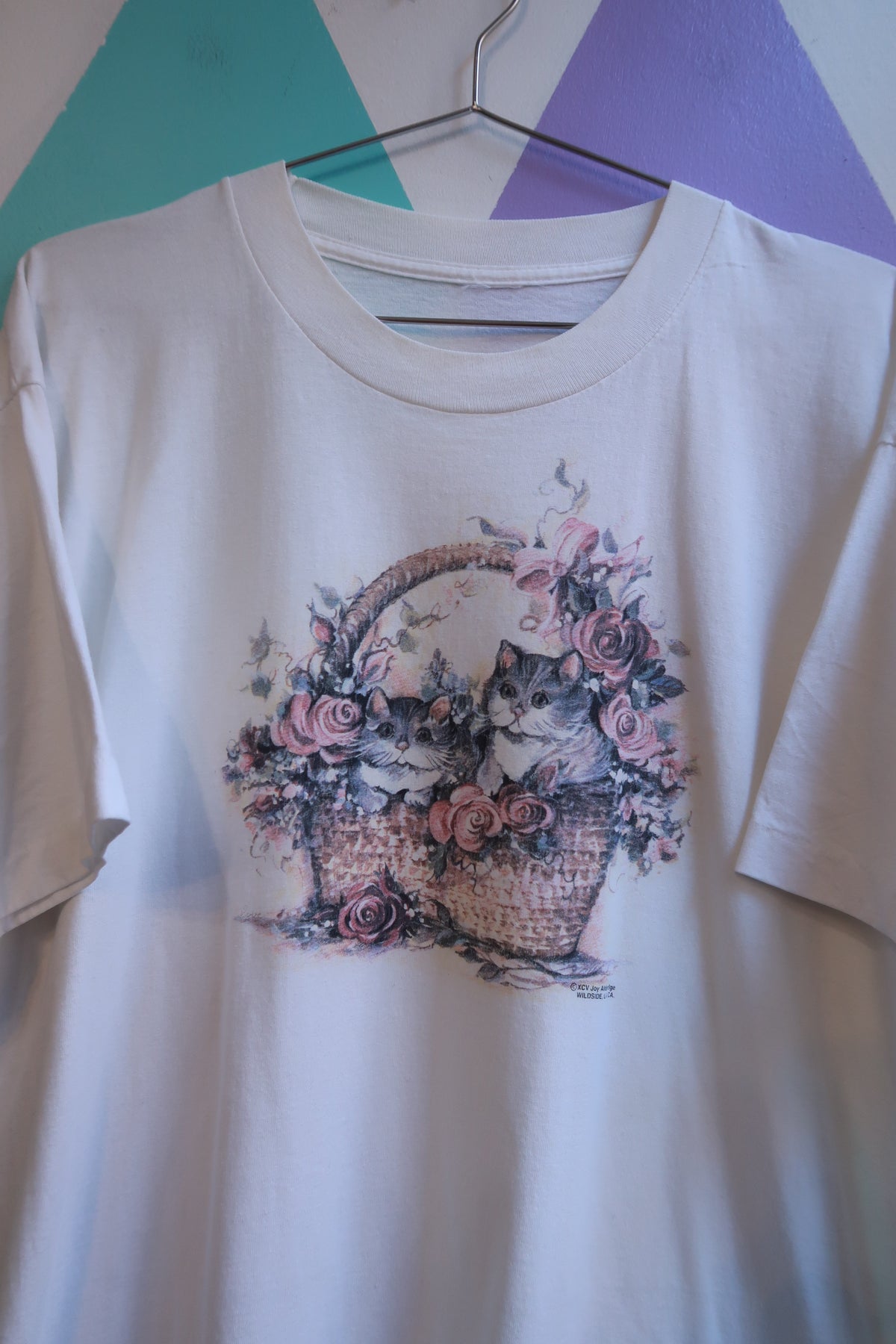 White men's T-shirt by Elektra Vintage featuring a vintage cottagecore kitten floral graphic in a basket design.