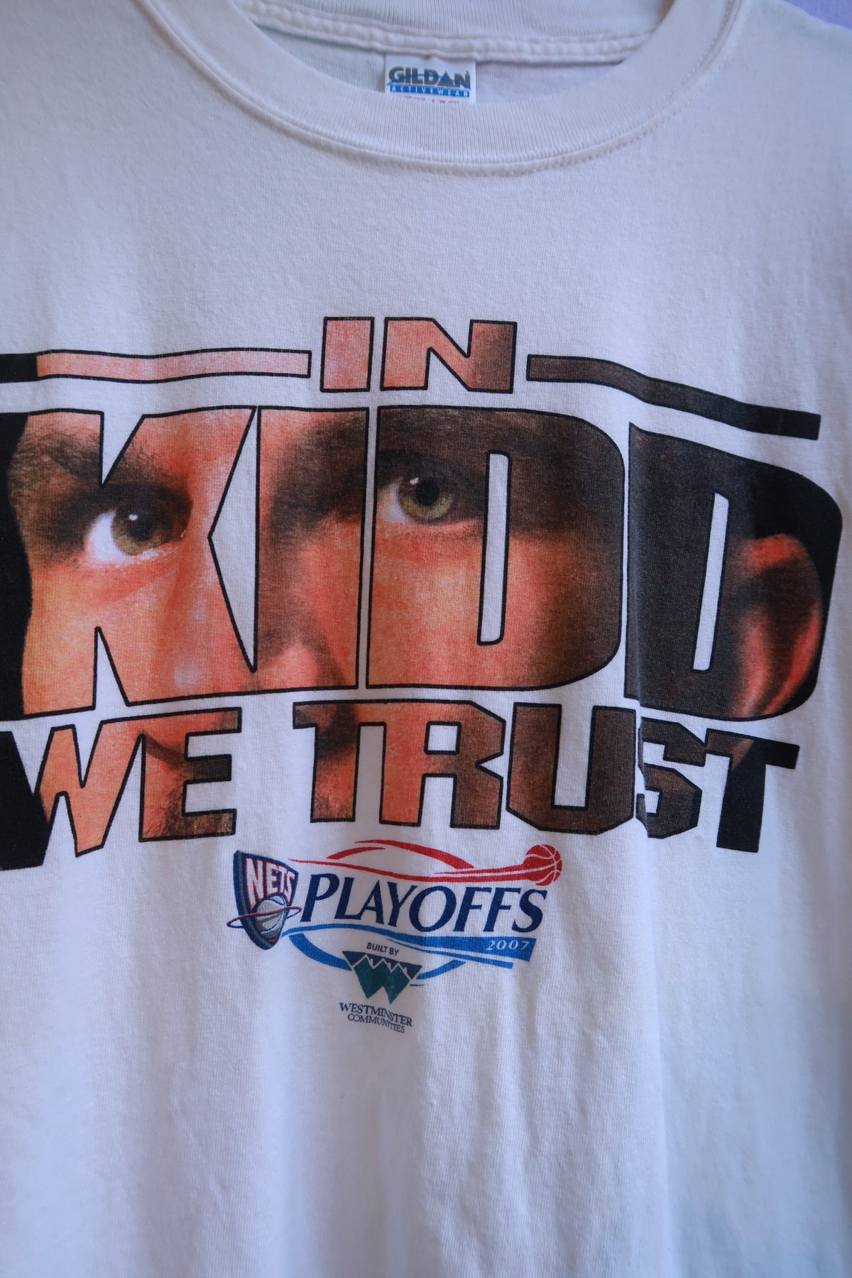 White men's T-shirt by Elektra Vintage featuring vintage 2007 NBA Playoffs "In Kidd We Trust" Jason Kidd graphic.