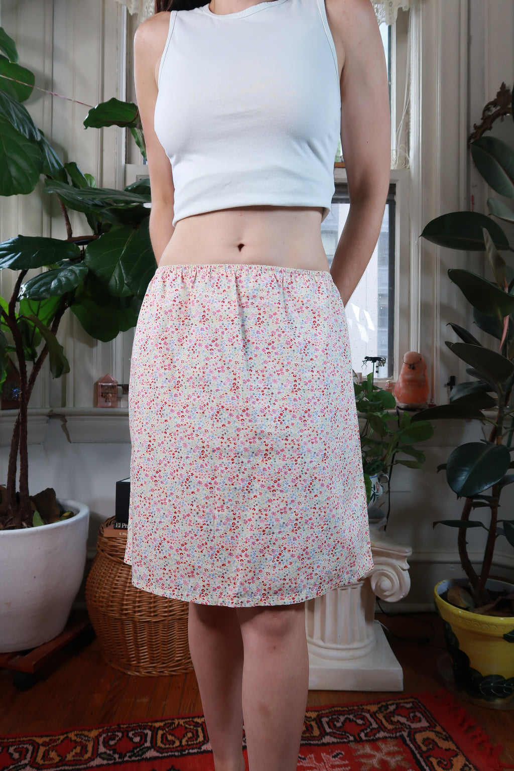 White ditsy floral midi skirt by Old Navy, vintage 2000s style, featuring a flowy fabric and floral pattern from Elektra Vintage.