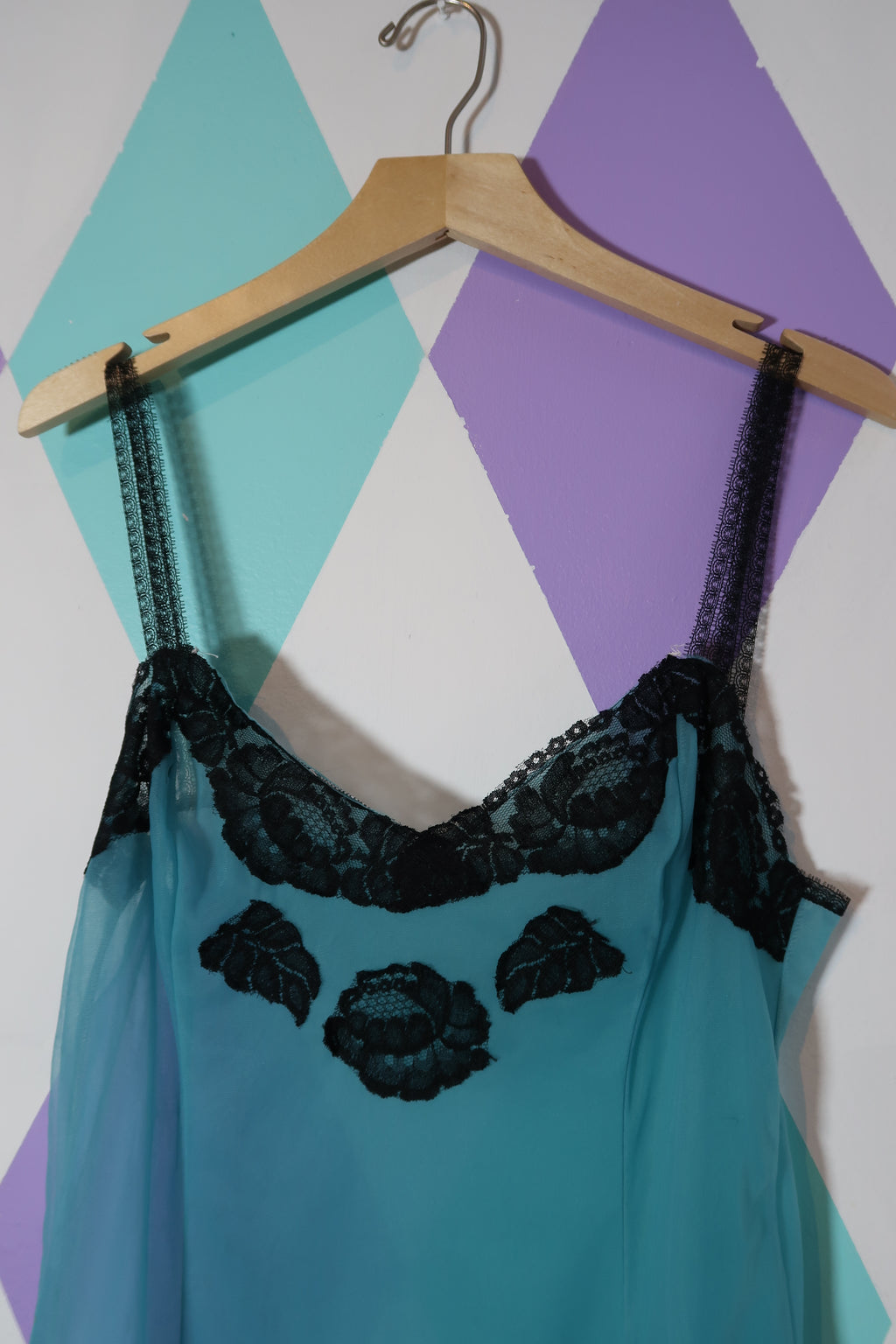 Vintage Elektra Vintage sheer blue slip dress with black lace detailing, flowing fabric, and elegant design.