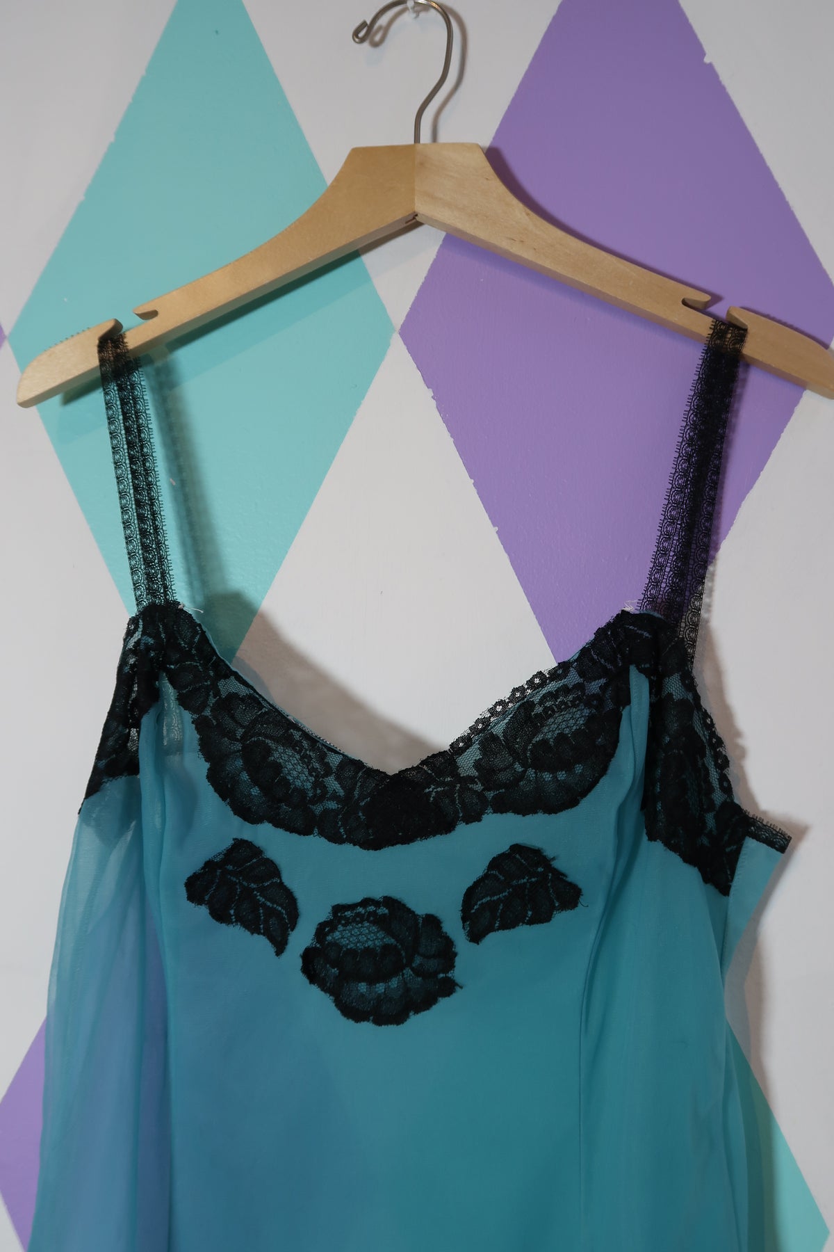 Vintage Elektra Vintage sheer blue slip dress with black lace detailing, flowing fabric, and elegant design.