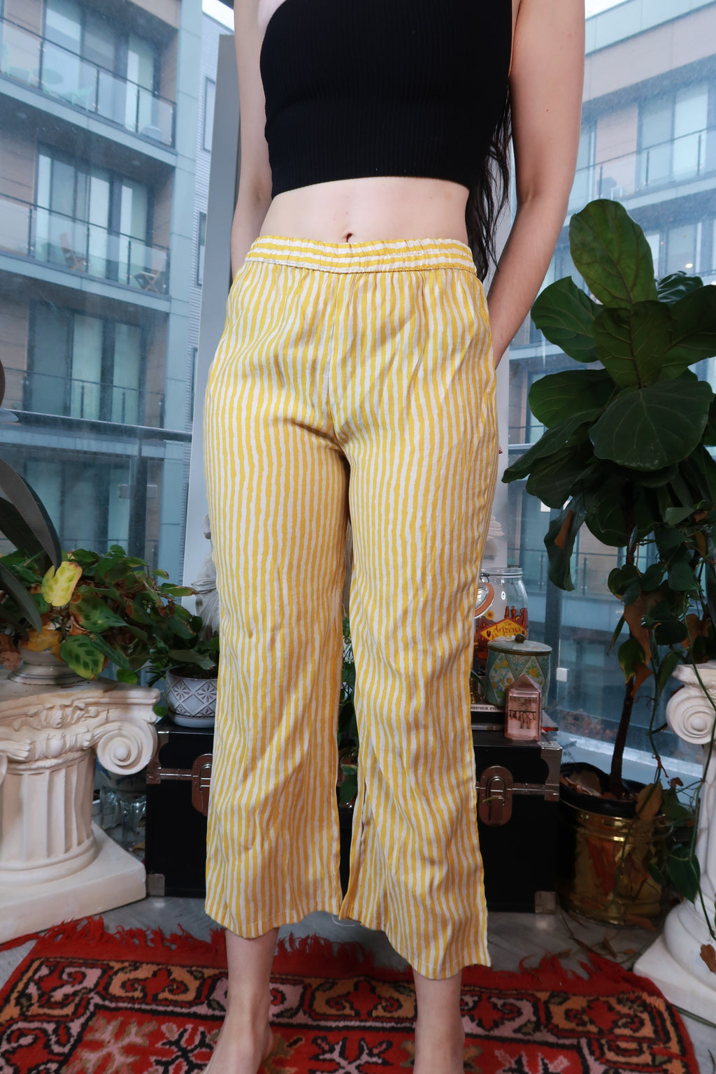 Vintage yellow and white striped cropped pants by Elektra Vintage, showcasing a pull-on style and relaxed fit.