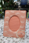Vintage pink lacy fabric picture frame by Elektra Vintage, showcasing intricate lace details and soft pink color.