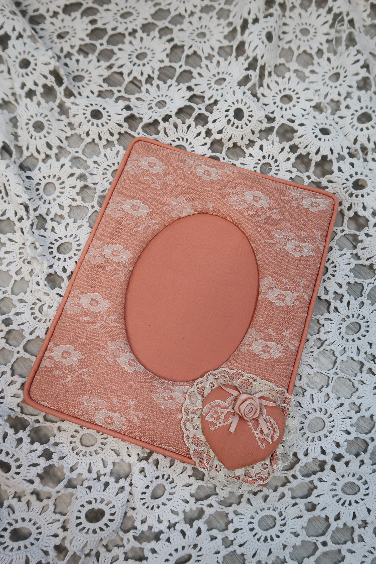 Vintage pink lacy fabric picture frame by Elektra Vintage, featuring intricate lace details and a classic design.