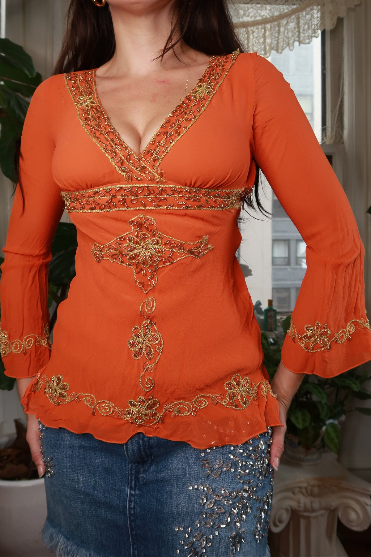 Vintage 2000s Bebe orange beaded silk top for women, featuring intricate beadwork and elegant style, by Elektra Vintage.