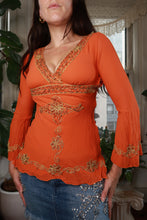 Load image into Gallery viewer, Vintage 2000s Bebe orange beaded silk women's top by Elektra Vintage, showcasing intricate beadwork and silky fabric.
