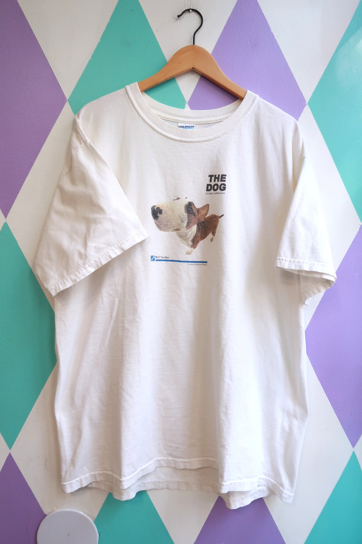 White vintage 2000s Elektra Vintage T-shirt featuring a graphic of a Bull Terrier dog from "The Dog" design.