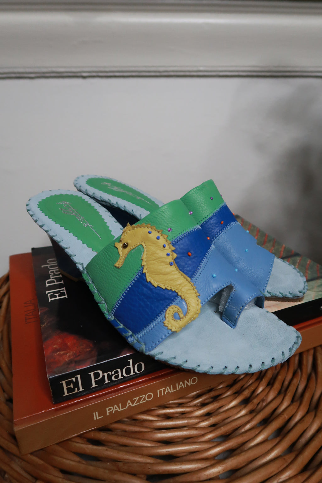Deadstock vintage 2000s leather wedge sandals with seahorse patchwork details from Elektra Vintage, showcasing the unique design and craftsmanship.