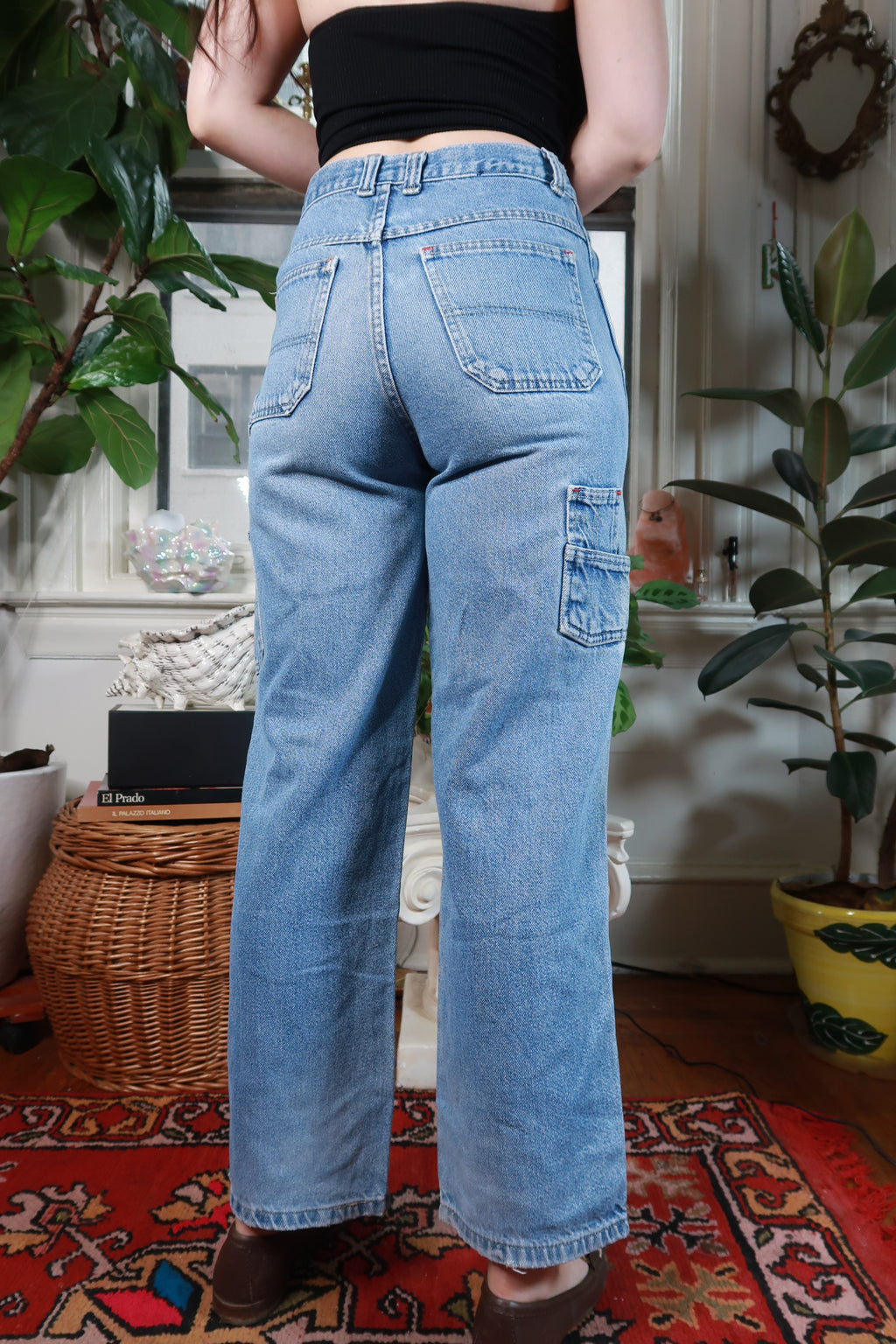 Light wash vintage Y2K cargo carpenter wide-leg jeans for women by Elektra Vintage, shown with distressed details and relaxed fit.