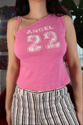 Pink asymmetrical tank top for women by Elektra Vintage, featuring a vintage 2000s Angel 22 design, styled on a mannequin.