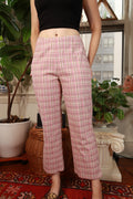 Vintage 2000s pink plaid low-rise straight leg women's pants by Elektra Vintage, showing the waist and leg details.