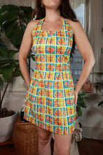 Load image into Gallery viewer, Vintage 2000s orange rose geometric print halter mini dress by Elektra Vintage, featuring a stylish halter neckline and vibrant floral pattern.
