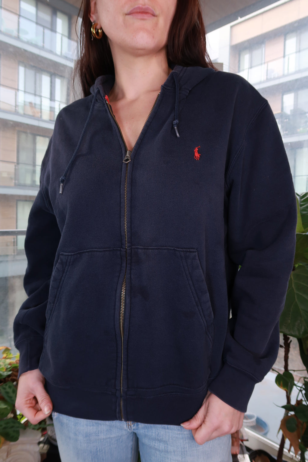 Vintage Polo Ralph Lauren navy zip-up hoodie featuring the classic pony logo, displayed on a neutral background.