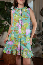 Load image into Gallery viewer, Vintage aqua floral sleeveless shift dress with ruffle hem from Elektra Vintage, 60s-70s style, displayed on a hanger.
