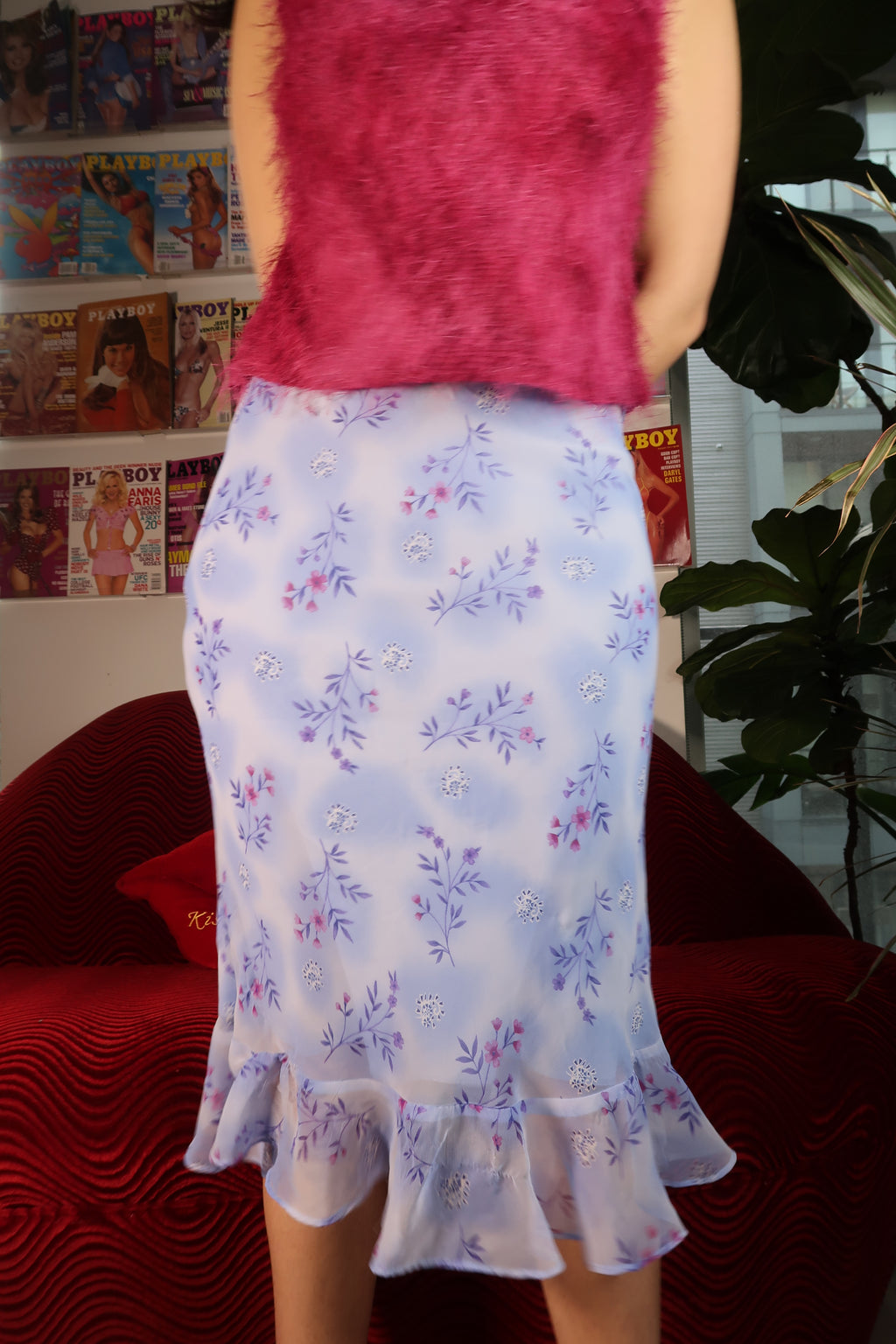 Light purple flower printed mermaid skirt by Elektra Vintage, showcasing a fitted silhouette with floral pattern and flowing hem.