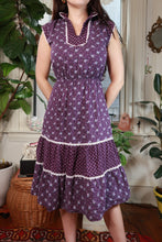 Load image into Gallery viewer, Vintage 70s purple floral prairie dress with lace trim and tiered skirt, styled by Elektra Vintage.
