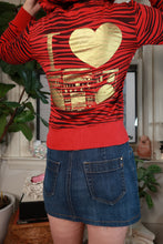 Load image into Gallery viewer, Elektra Vintage women's zip-up hoodie with red and black zebra print, cat ear details, vintage 2000s Abbey Dawn style.

