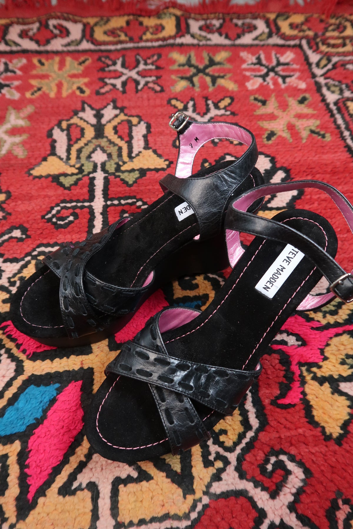 Deadstock vintage Steve Madden black platform wedges with strappy Y2K design, featuring chunky heels and ankle straps.