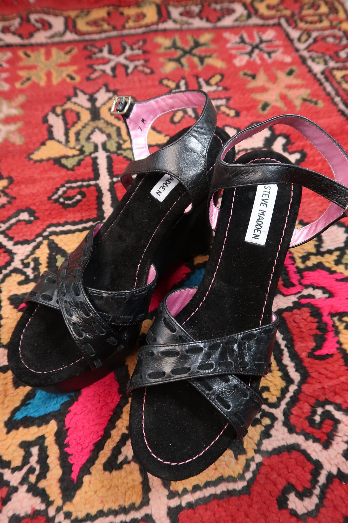 Black vintage Steve Madden platform wedges with strappy design, featuring a Y2K-inspired style and chunky heel from Elektra Vintage.