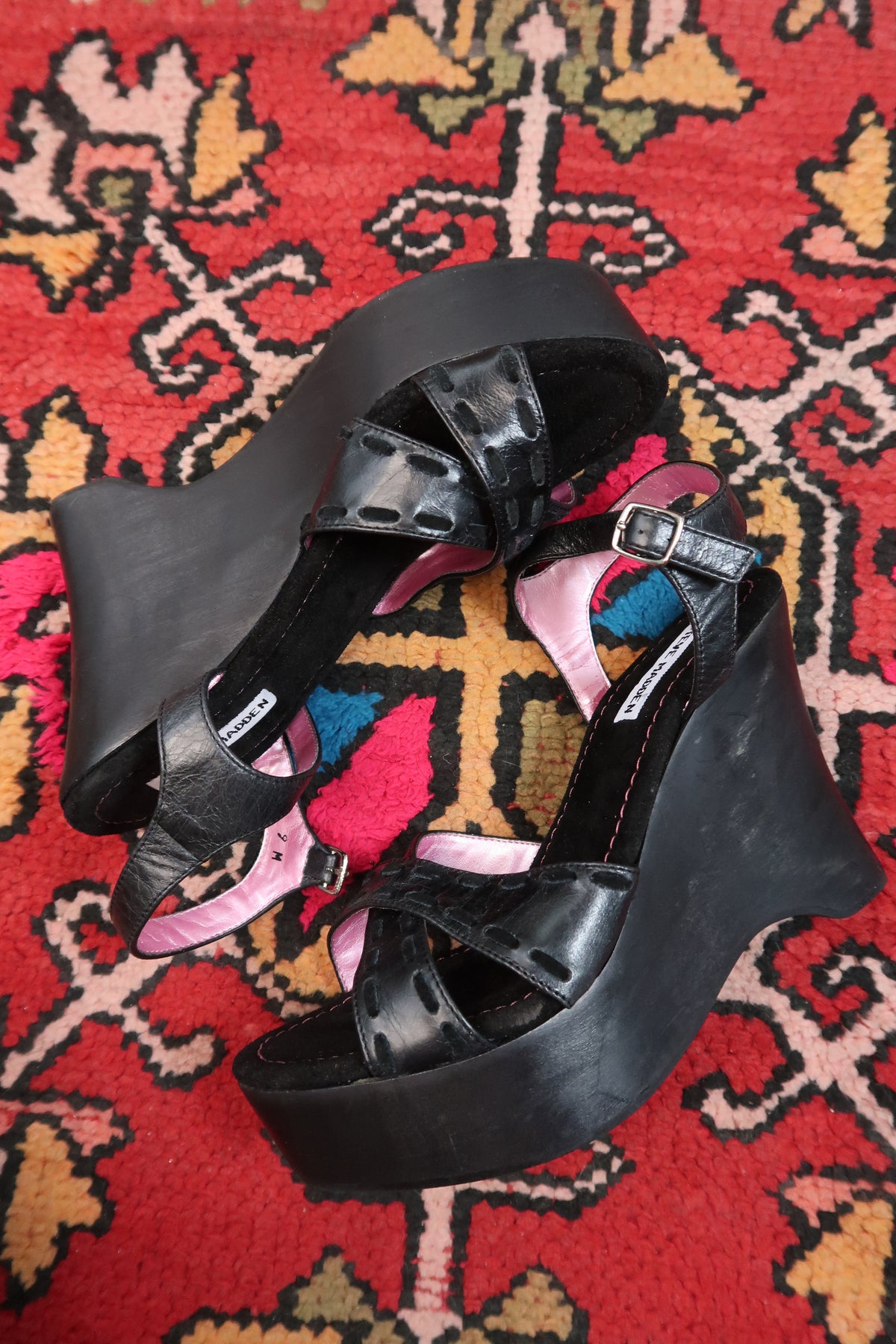 Black vintage Steve Madden platform wedges with Y2K strappy design, displayed on a neutral background.