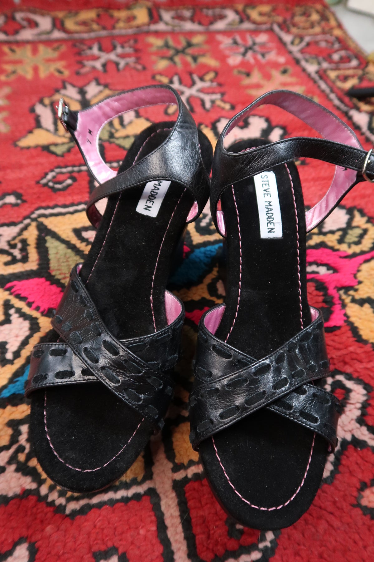 Deadstock vintage Steve Madden black platform wedges with Y2K strappy design, featuring chunky heels and ankle straps.