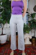 Vintage Y2K Reebok grey wide leg sweatpants from Elektra Vintage, featuring a relaxed fit and classic athletic style.