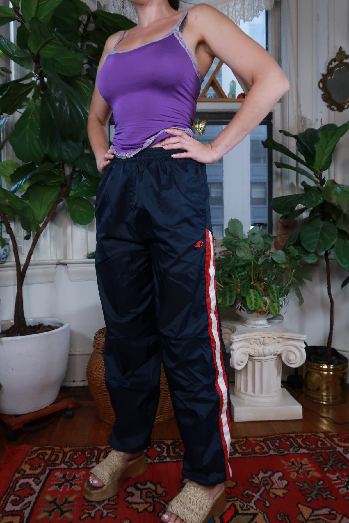 Vintage Y2K Navy Blue Track Pants for women by Elektra Vintage, featuring a classic sporty design and comfortable fit.