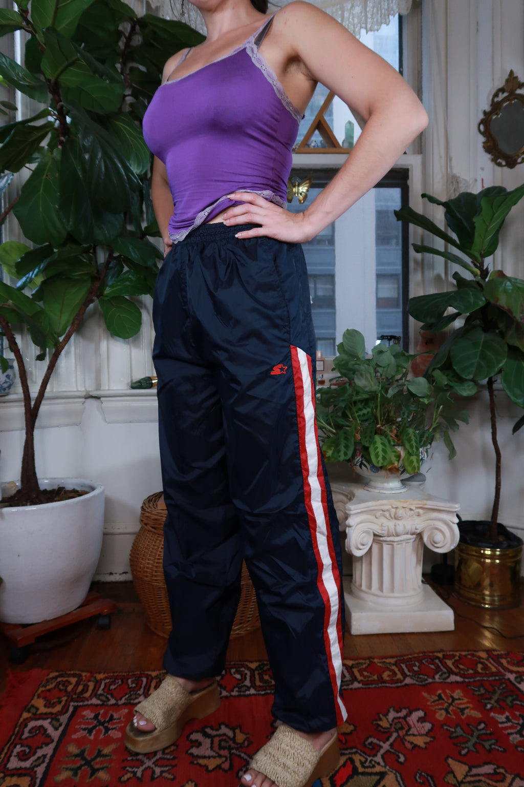 Vintage Y2K Navy Blue Starter track pants for women by Elektra Vintage, featuring a relaxed fit and athletic style.